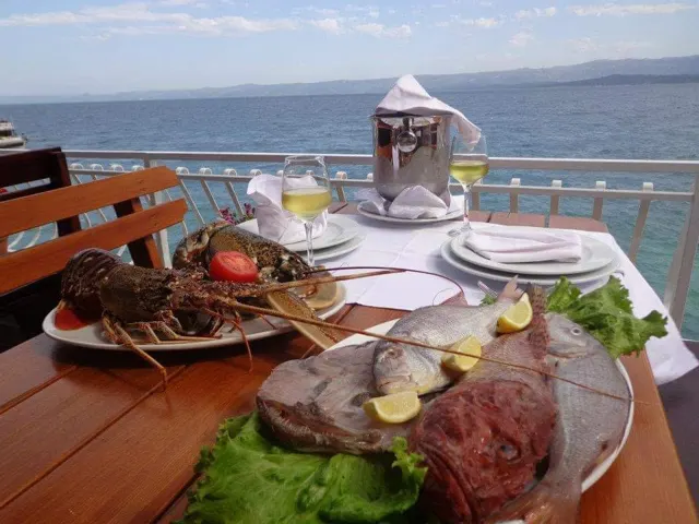 Grilled fish platter served with a sea view