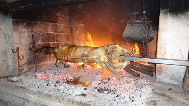 Lamb roasting on a spit over an open fire